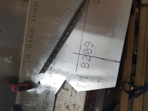 Top skin trimmed to allow for rudder movement, electric trim location marked installation