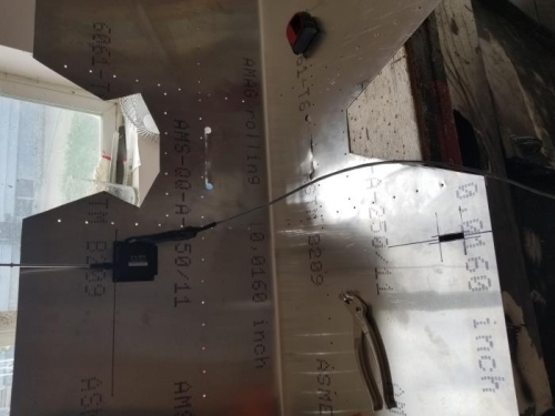 Drilled and clecoed the elevator trim acuator in place, cut out slot for actuator rod