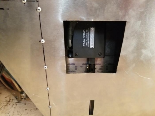 Riveted electric trim actuator in place