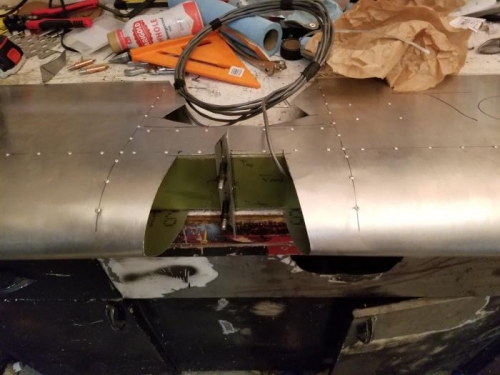 Drilled/clecoed elevator hinge bracket, and trimmed excess material off the leading edge to ensure fit