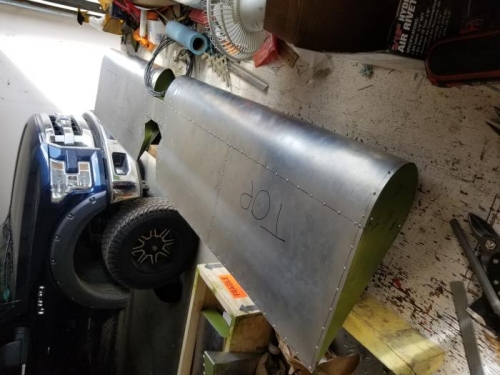 Riveted/finish trimmed trailing edge on passenger side