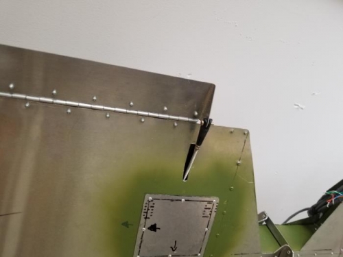 Cut/installed pushrod on the electric trim control surface.,