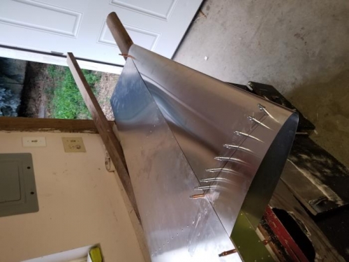 I aligned the nose skin on the rudder and clecoed along both sides of the nose rib.