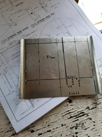 Laid out and drilled pilot holes on rear mounting bracket