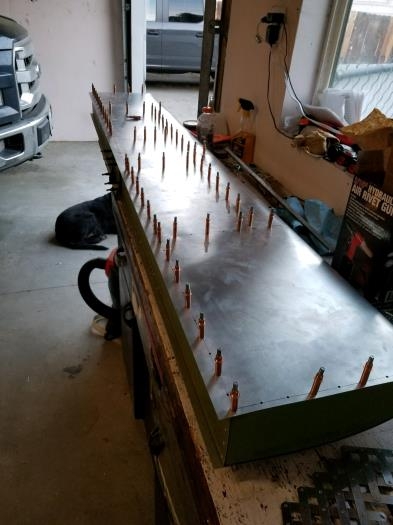 Finished drilling and clecoing top skin on skeleton