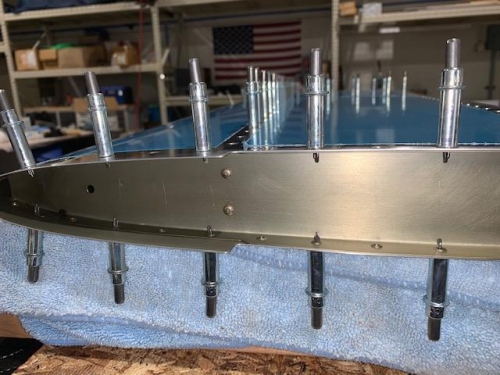 Rivet front spar to end rib