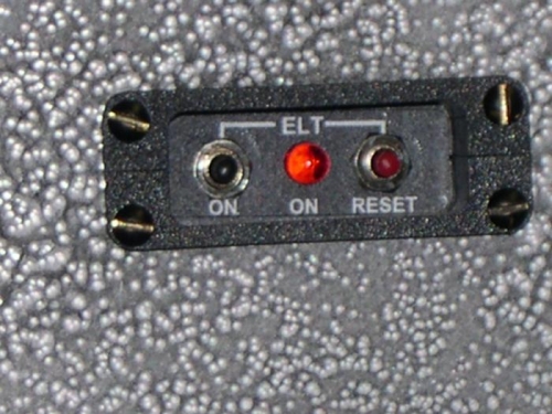 Remote on instrument panel above throttle