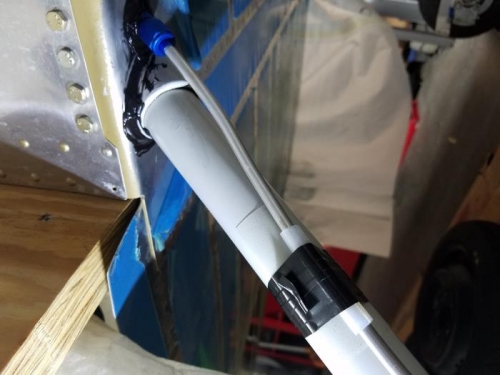 RTV to seal gap where LG weldment exits fuselage