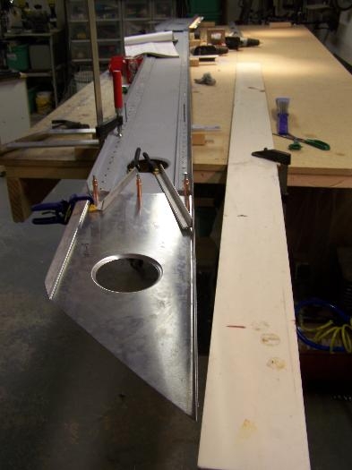 Setting dyhedral. When the straight edge is raised they touch.