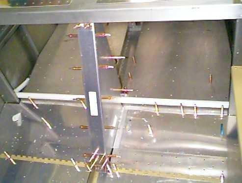 Electric flap motor/mechanism enclosure clecoed in place,