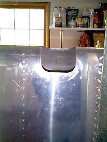 Hole cut into leading edge of the left wing for the landing light