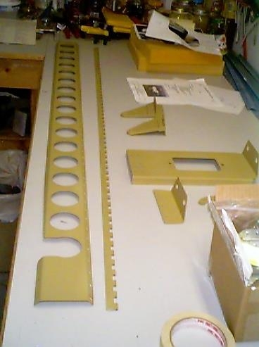 Primed left flap brace and landing light components.