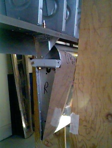 Inboard aileron bracket clecoed to the rear spar.