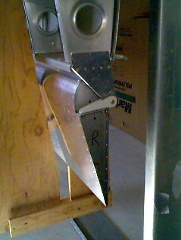 Outboard aileron bracket clecoed to the rear spar.