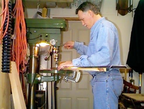 Me cutting the lightening holes into the flap brace-right wing.