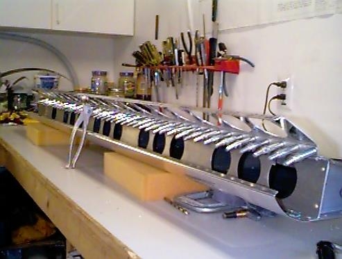 Flap brace clecoed to the flap.