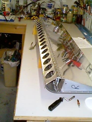 Flap brace clecoed to the flap.