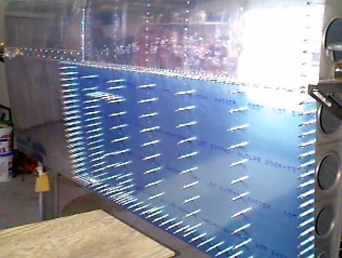 Right wing top skin drilled and clecoed in place.