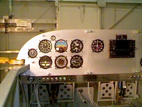 Left side of panel shows switch breakers and ignition.