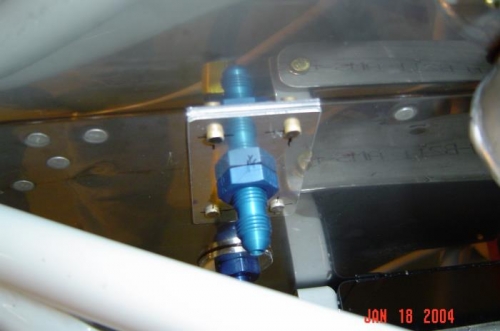 Purge line trough firewall fitting.