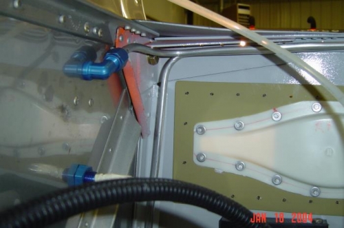 Purge line routing inside firewall.