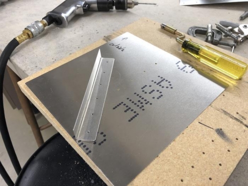Holes we drilled in raw stock to create stiffeners.