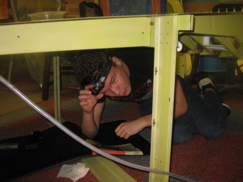 My son laying on the floor bucking rivets..until he dropped the tungsten bar on his head