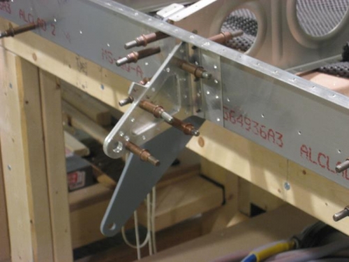 Aileron bracket assembly installed to the rear spar
