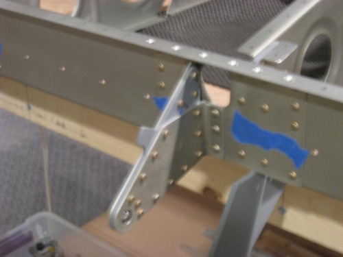 Aileron brackets attached to the rear spar