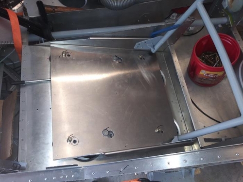 Offset pilot seat pan for clearnce