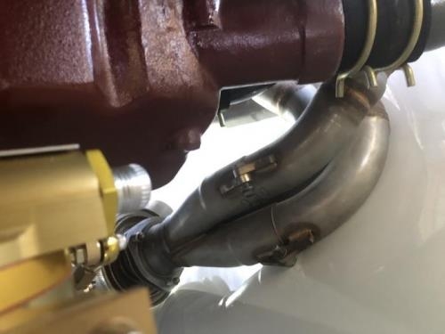 LH exhaust header contacting cowling