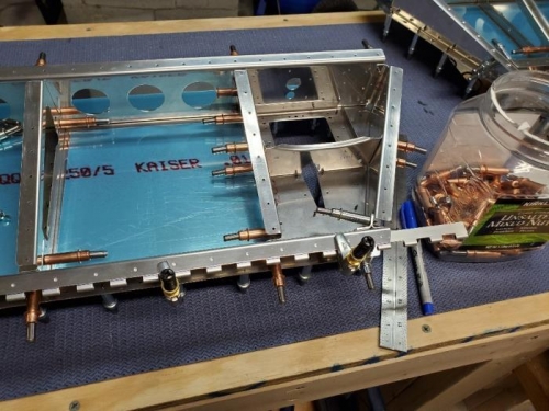 Forward trim tab hinge