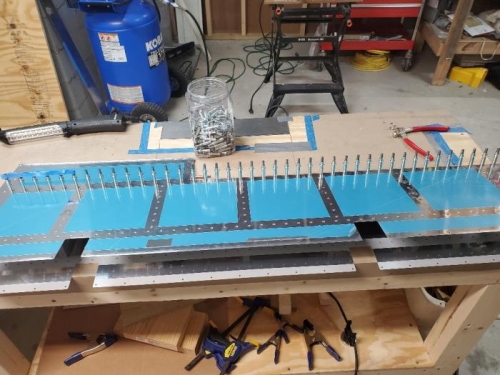 Left skins clecoed for rear spar riveting