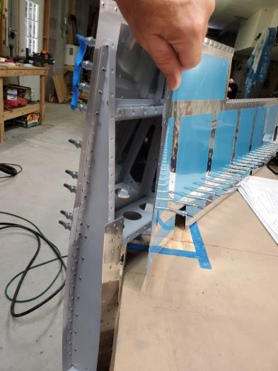 Access from bottom panel to reach AD3-3 rivets on top panel