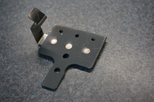 Parking brake valve bracket and retaining clip