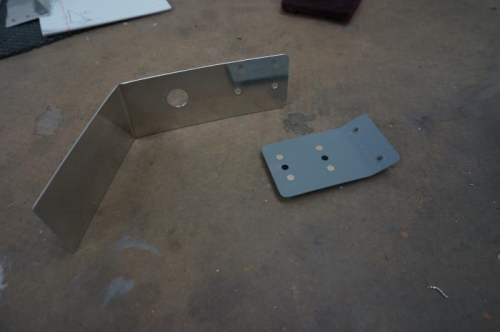 One piece main ELT antenna support bracket and attach flange