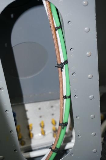 Hose/wire/coax bundle in LH gear tower