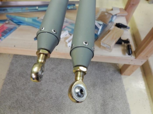 Installed aileron torque tube rod end bearings