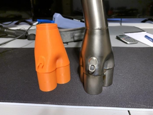 Side-by-side comparison of the preliminary 3D printed model and the original steel pipes.