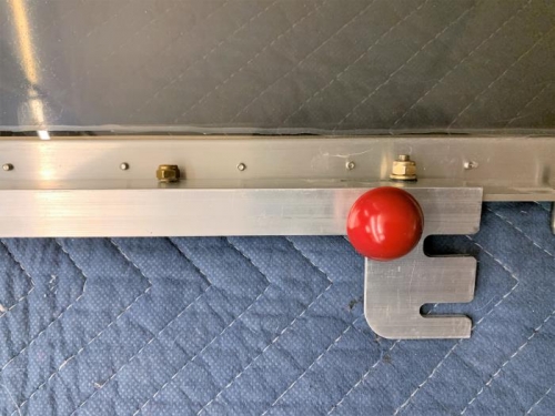 The latch spring retaining screw and the slide assembly ball knob installed.