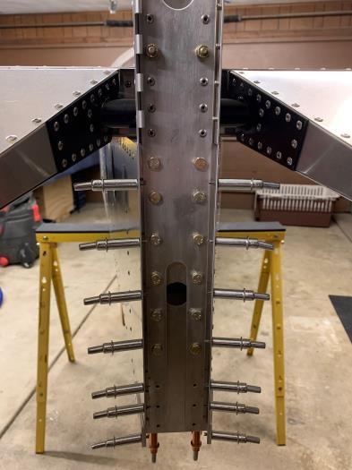 Bolting vertical stabilizer main spar assembly.