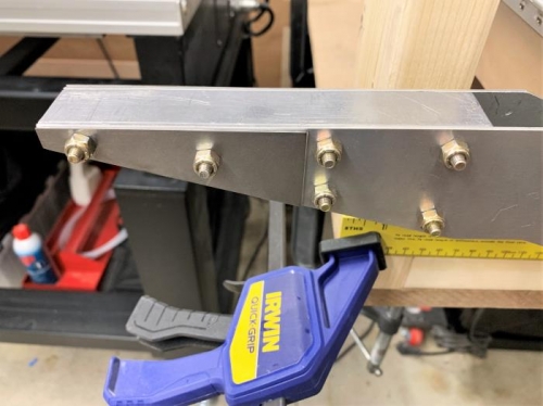 16 gauge steel flat weight plates added to the sides of the counter balance arms.