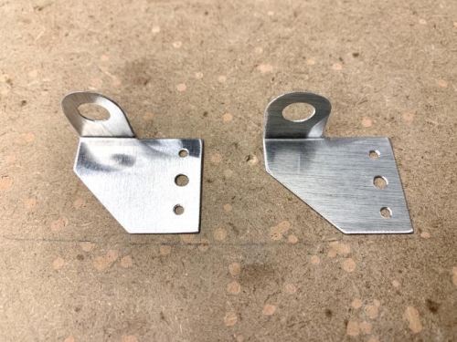 Cut, bent and deburred metal clamp sheet work from 0.025