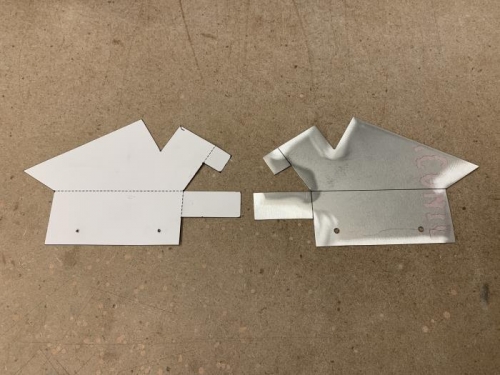 Card stock folding template and corresponding metal work, ready to fold.