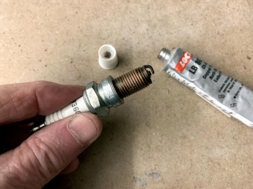 Applying CopperMax anti-seize compound to the threads of the spark plugs when reinstalling them.