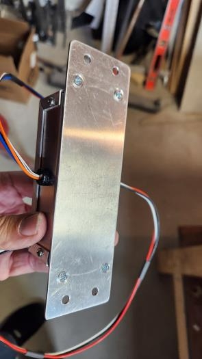 Flush screws holding module to bracket plate.