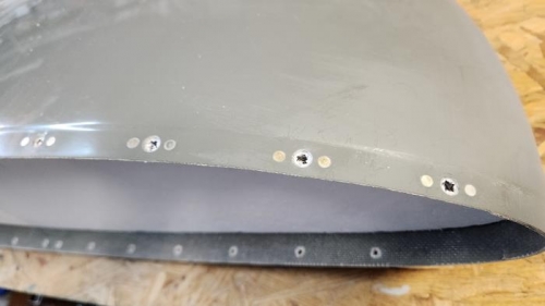 Nutplates riveted on the top surface