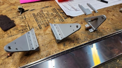 Left is LEFT outboard aileron hinge. On the right are the two for the RIGHT spar.