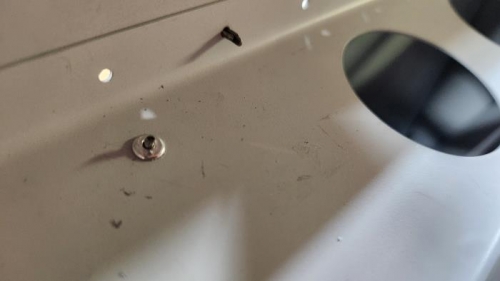 These pulled rivets don't often break off level with the rivet.