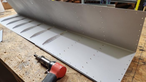 Back riveting the aileron stiffeners